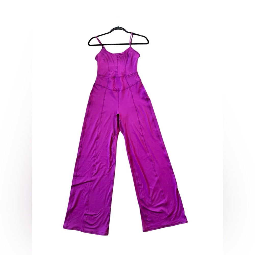 NWOT FP Movement by Free People Magenta up at night onesie flare Leg size XS